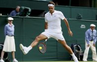 Roger Federer of Switzerland hits a shot through his legs during his match against Sam Querrey of the U.S.A. at the Wimbledon Tennis Championships in London